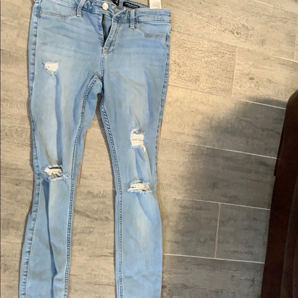 light blue ripped jeans